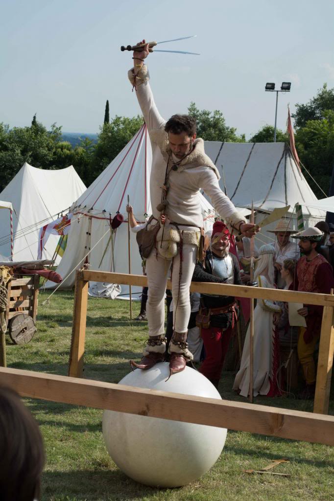Here's a medieval jester entertaining the spectators between fights
